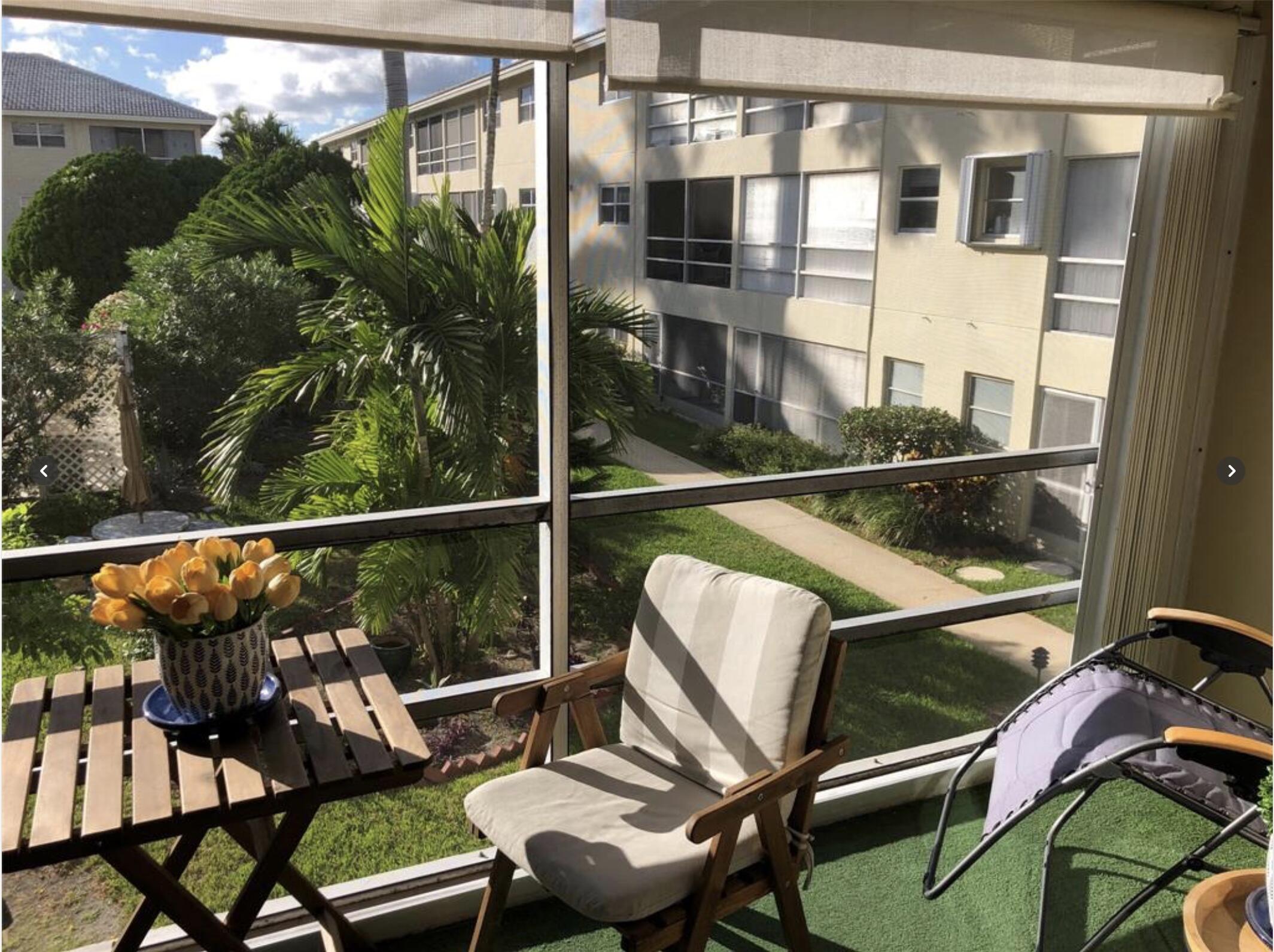 1951 Northeast 39th Street Northeast, Unit 249 Lighthouse Point, FL 33064 - Photo 2 of 23 a view of a balcony with chairs and wooden floor