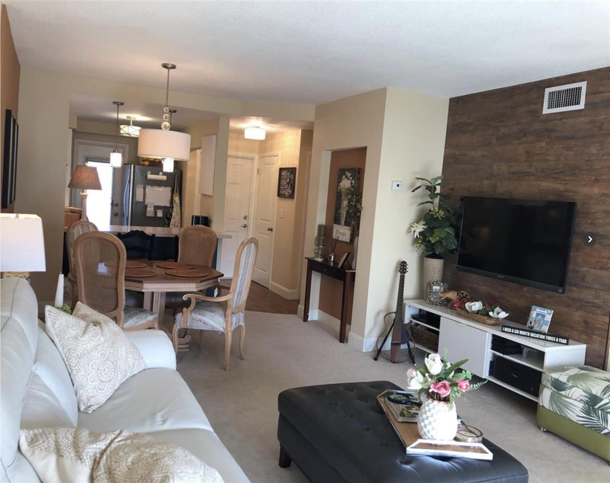 1951 Northeast 39th Street Northeast, Unit 249 Lighthouse Point, FL 33064 - Photo 23 of 23 a living room with furniture and a fireplace