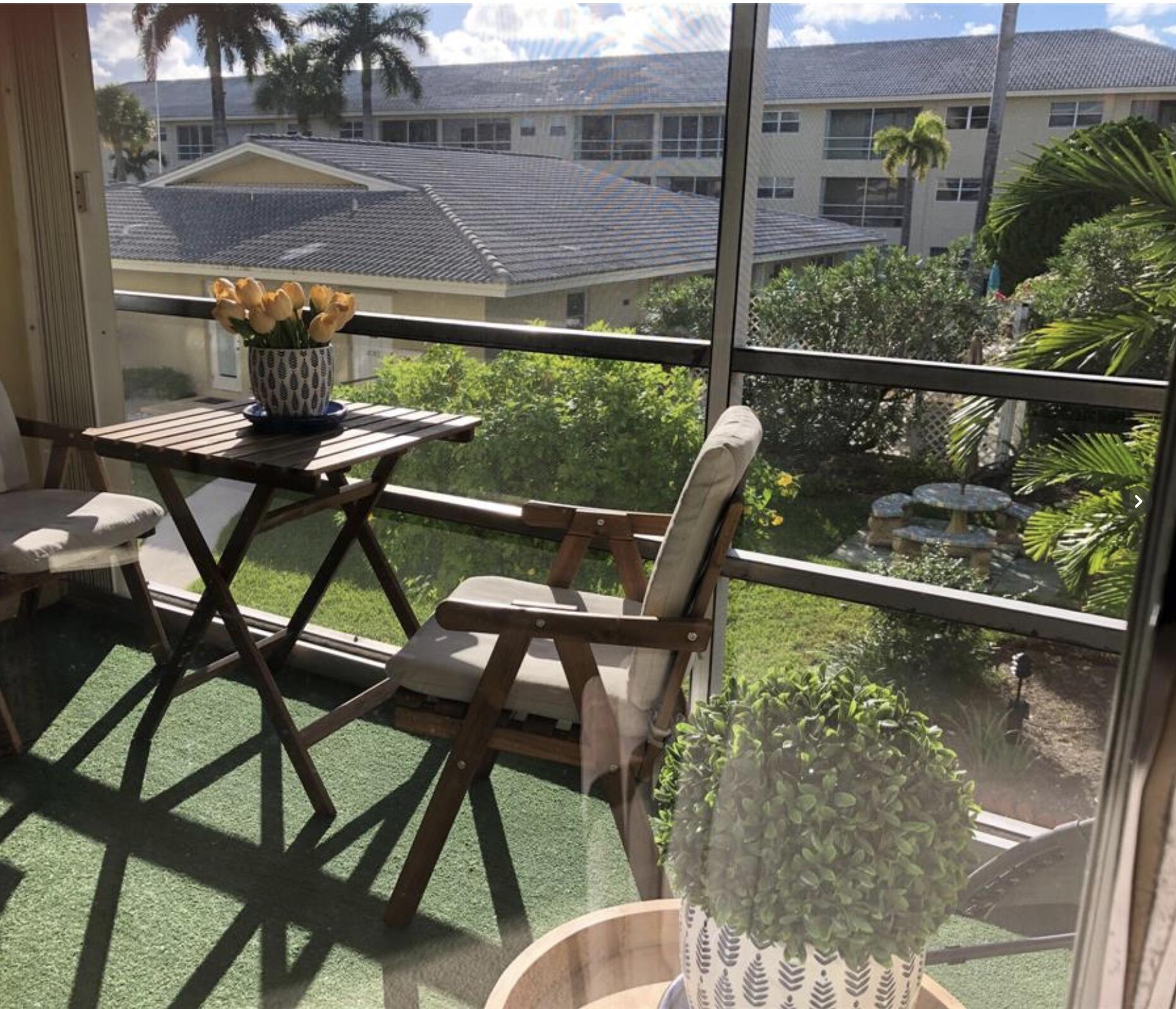 1951 Northeast 39th Street Northeast, Unit 249 Lighthouse Point, FL 33064 - Photo 3 of 23 a view of a chairs and table in the balcony