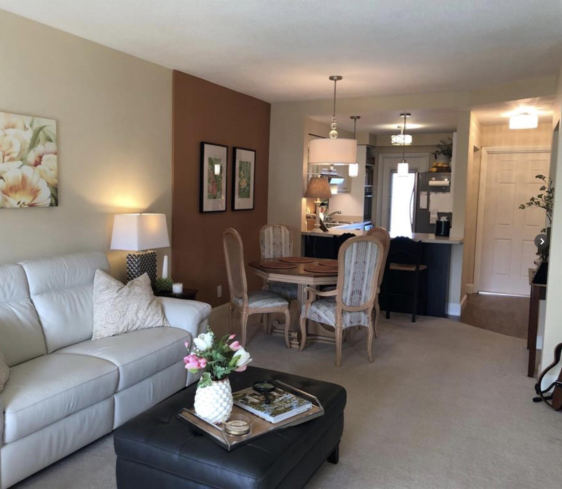 1951 Northeast 39th Street Northeast, Unit 249 Lighthouse Point, FL 33064 - Photo 4 of 23 a living room with furniture and a chandelier