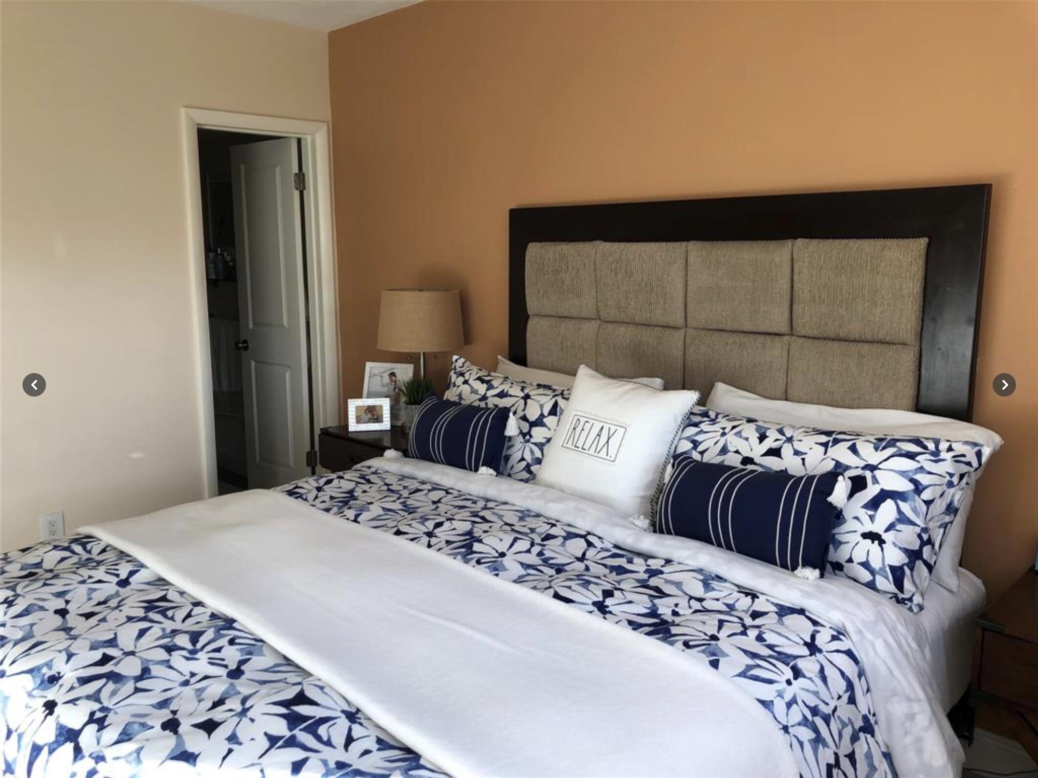 1951 Northeast 39th Street Northeast, Unit 249 Lighthouse Point, FL 33064 - Photo 10 of 23 a bedroom with a large bed and a window