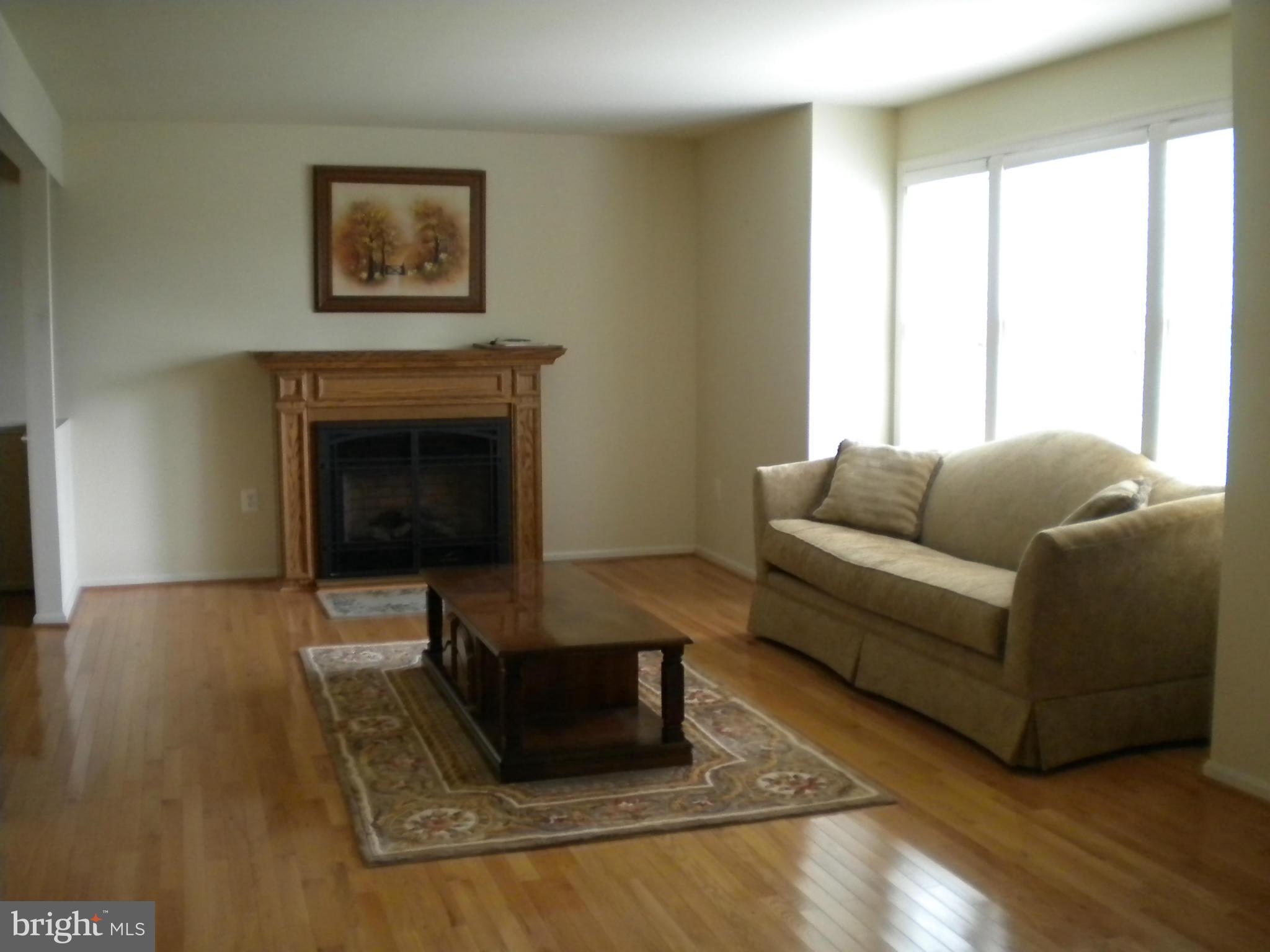 2813 Northwind Road Baltimore, MD 21234 - Photo 3 of 21 Bay window, wood floors and fireplace