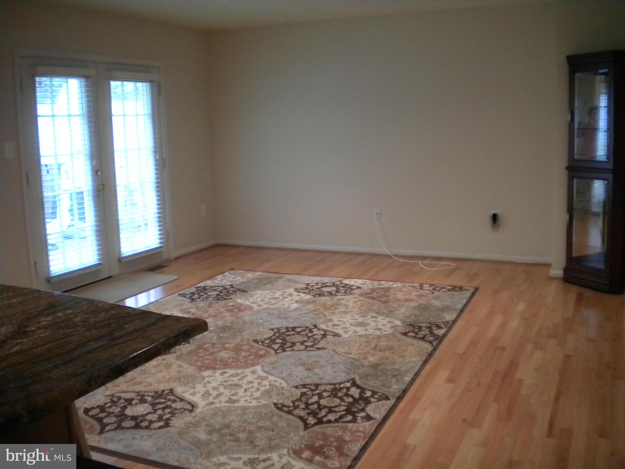2813 Northwind Road Baltimore, MD 21234 - Photo 8 of 21 Family Room w/wood floors and French door to deck.
