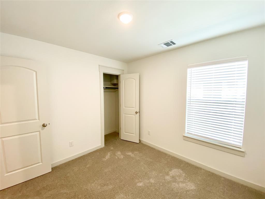 1372 Cedar Street Forney, TX 75126 - Photo 12 of 13 Unfurnished bedroom with carpet floors and a closet