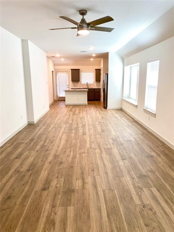 1372 Cedar Street Forney, TX 75126 - Photo 5 of 13 Unfurnished living room featuring a ceiling fan, light wood-style floors, and recessed lighting