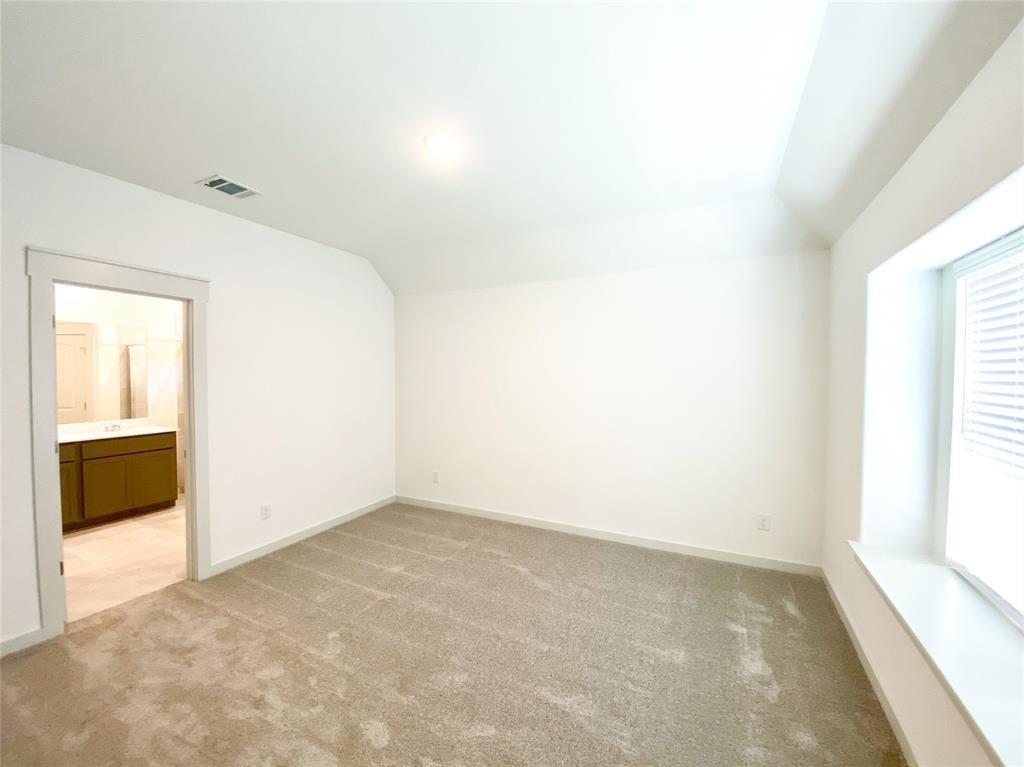 1372 Cedar Street Forney, TX 75126 - Photo 7 of 13 Additional living space with light carpet and lofted ceiling
