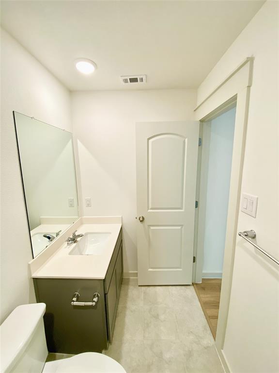 1372 Cedar Street Forney, TX 75126 - Photo 9 of 13 Half bathroom with vanity and light tile patterned floors