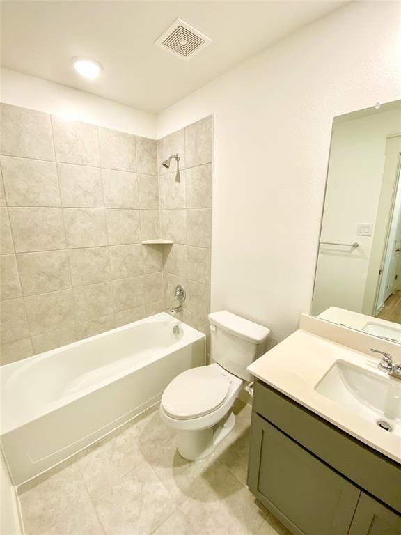 1372 Cedar Street Forney, TX 75126 - Photo 10 of 13 Bathroom with shower / washtub combination, vanity, and light tile patterned floors