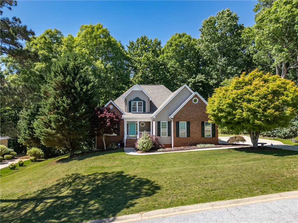 110 Brookstone Way Central, SC 29630 - Photo 39 of 46 This charming home features a well-maintained lawn and a welcoming entryway.