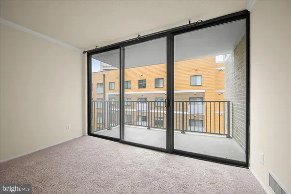 a view of an empty room with a window