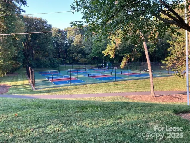 a view of a yard with swimming pool
