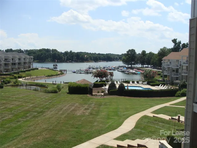 a view of a lake with a car parked