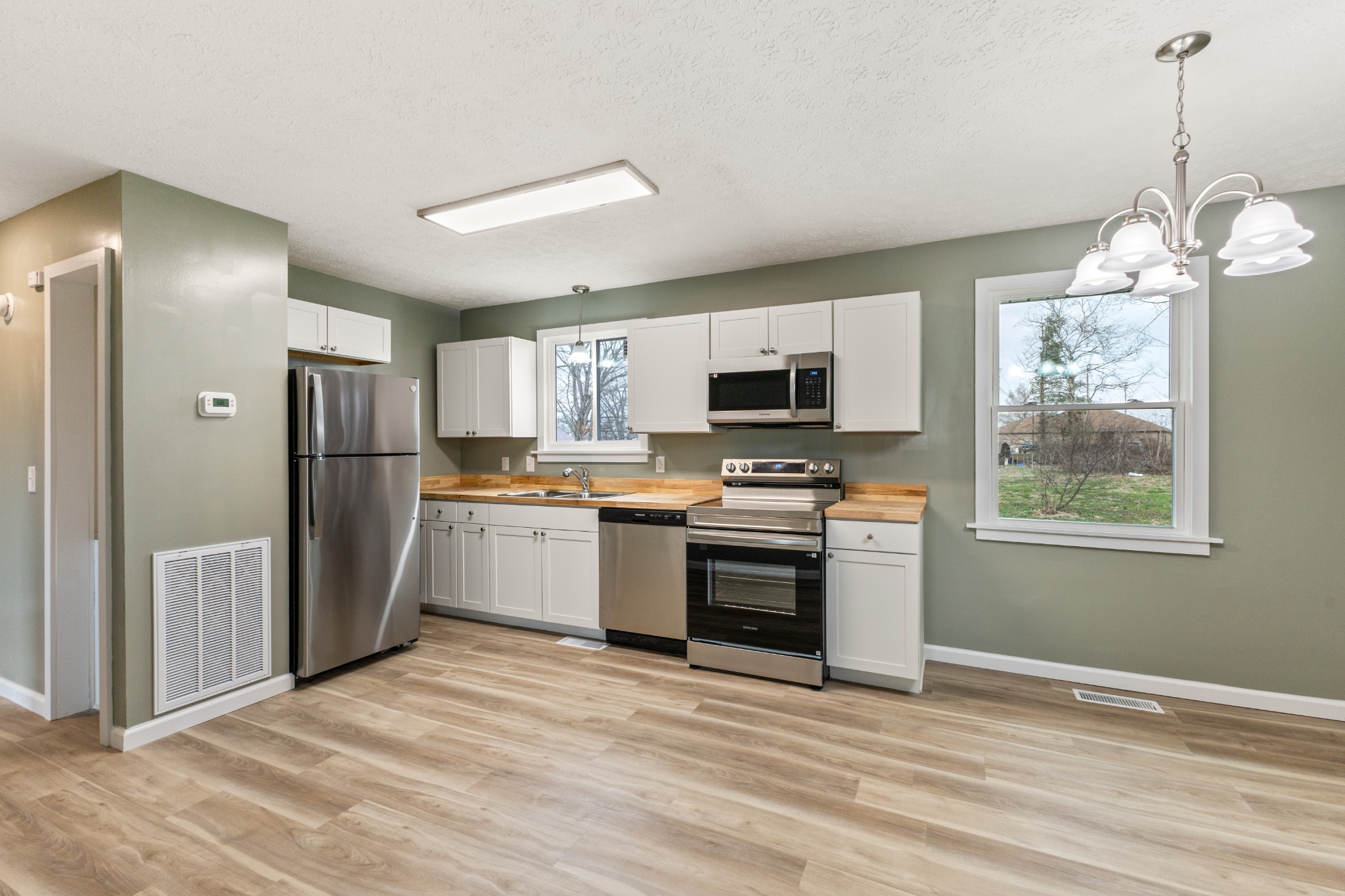 7109 King Road Fairview, TN 37062 - Photo 13 of 26 a kitchen with stainless steel appliances granite countertop a refrigerator and a stove top oven