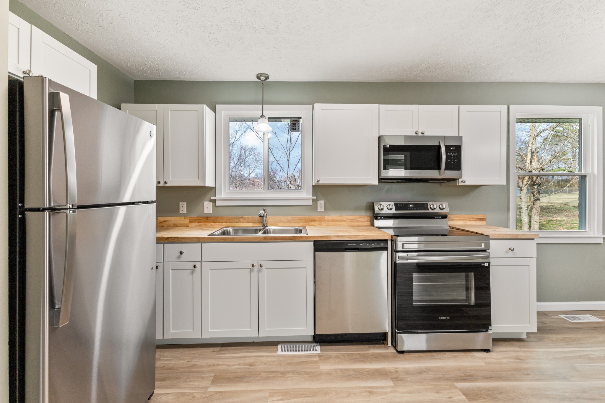 7109 King Road Fairview, TN 37062 - Photo 14 of 26 a kitchen with stainless steel appliances a refrigerator stove and microwave