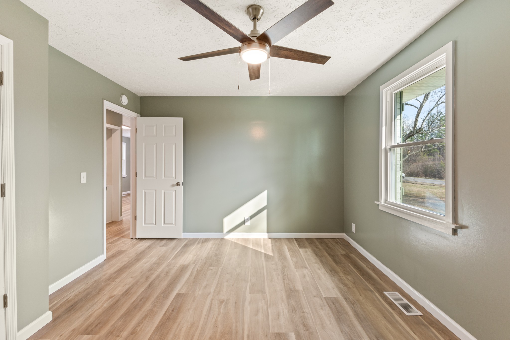 7109 King Road Fairview, TN 37062 - Photo 20 of 26 a view of empty room with wooden floor and fan