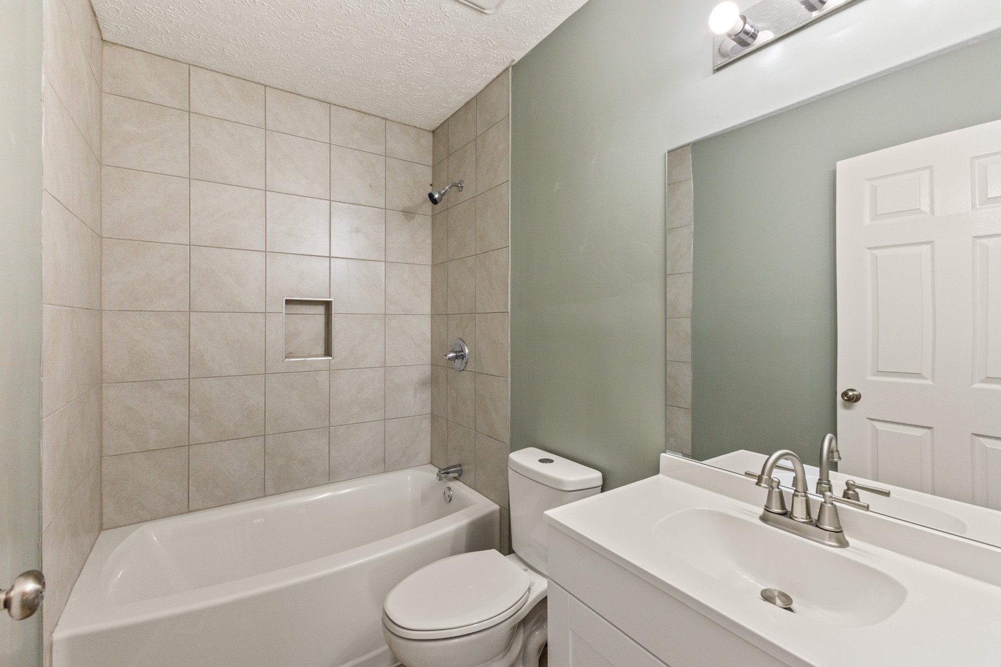 7109 King Road Fairview, TN 37062 - Photo 25 of 26 a bathroom with a toilet a sink and bathtub
