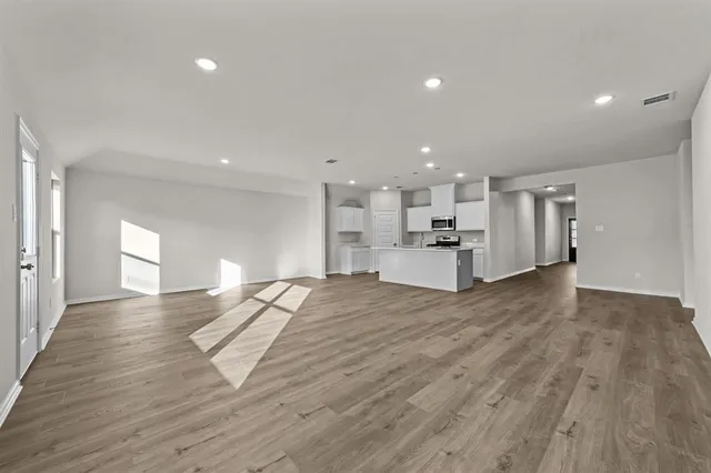 a view of kitchen and refrigerator