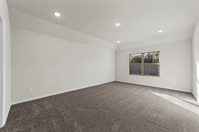 an empty room with a empty space and window