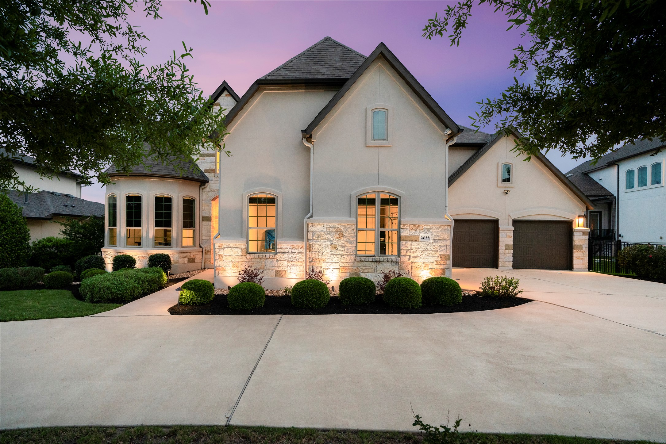 2033 Portobello Road Leander, TX 78641 - Photo 9 of 39 Impressive architecture, detailed landscaping, lighting, and a circular drive are sure to impress as soon as you arrive.