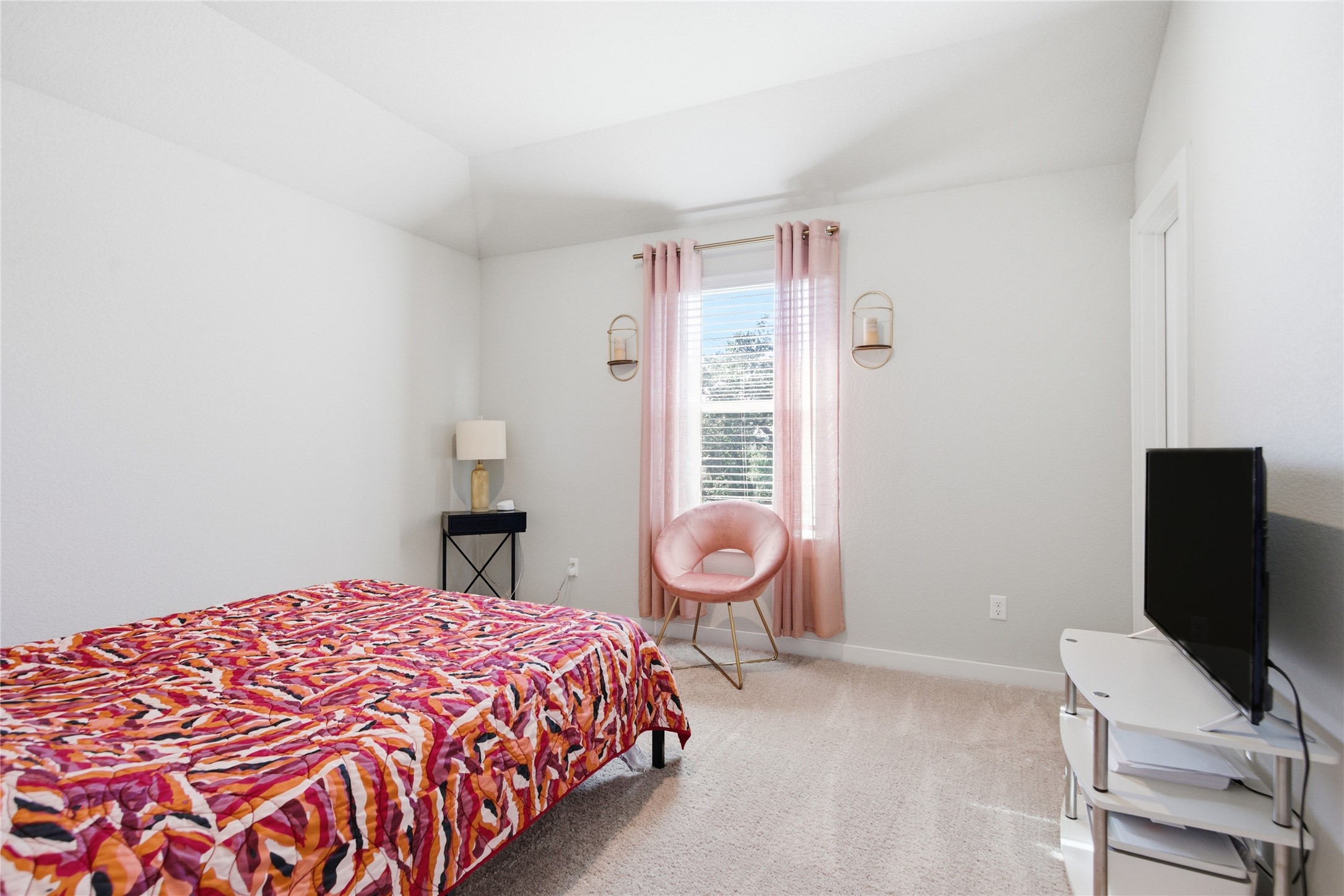 1008 Summer Glen Georgetown, TX 78628 - Photo 28 of 34 a bedroom with a bed and a flat screen tv