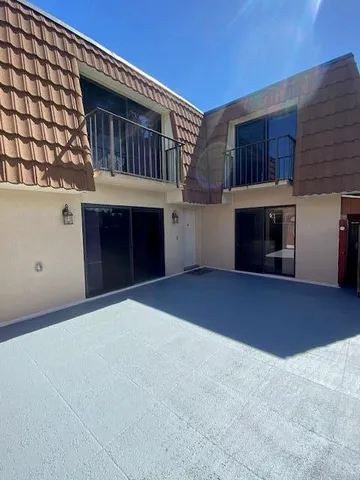 a front view of a house with a garage