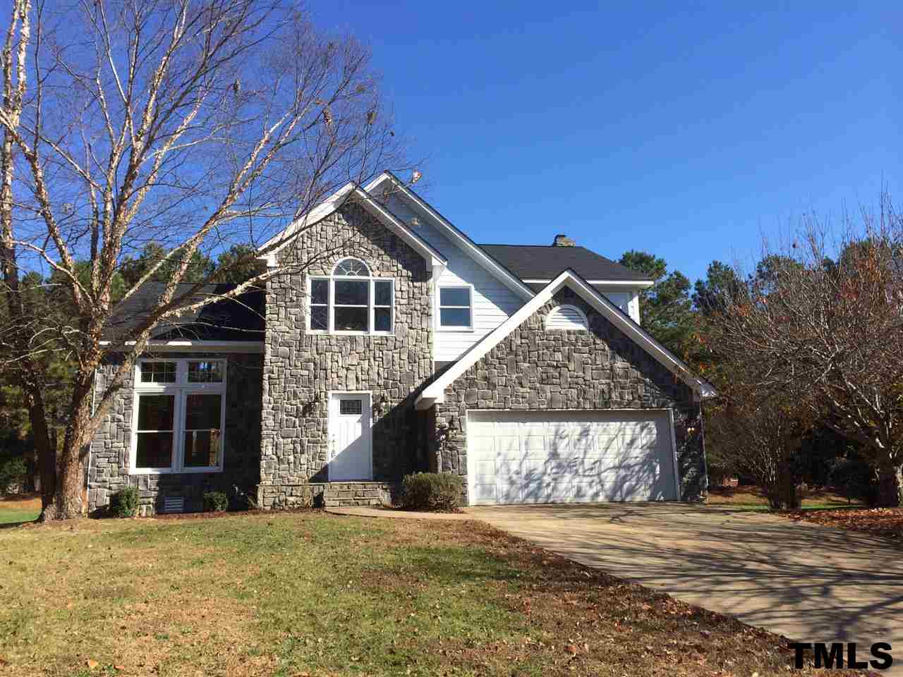 1607 Edenderry Court Garner, NC 27529 - Photo 1 of 22 a view of a house with a yard and large tree