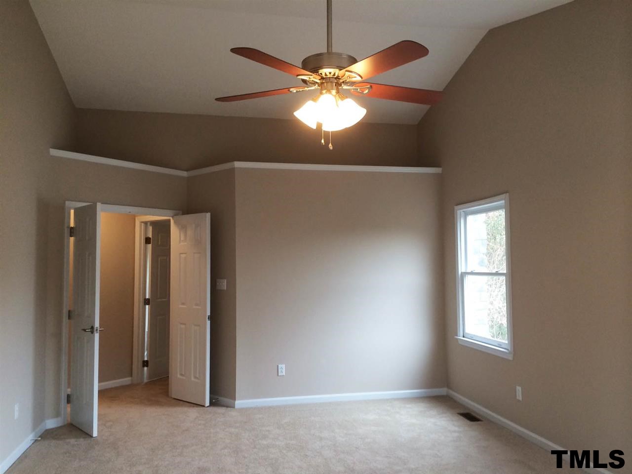 1607 Edenderry Court Garner, NC 27529 - Photo 12 of 22 an empty room with windows and fan
