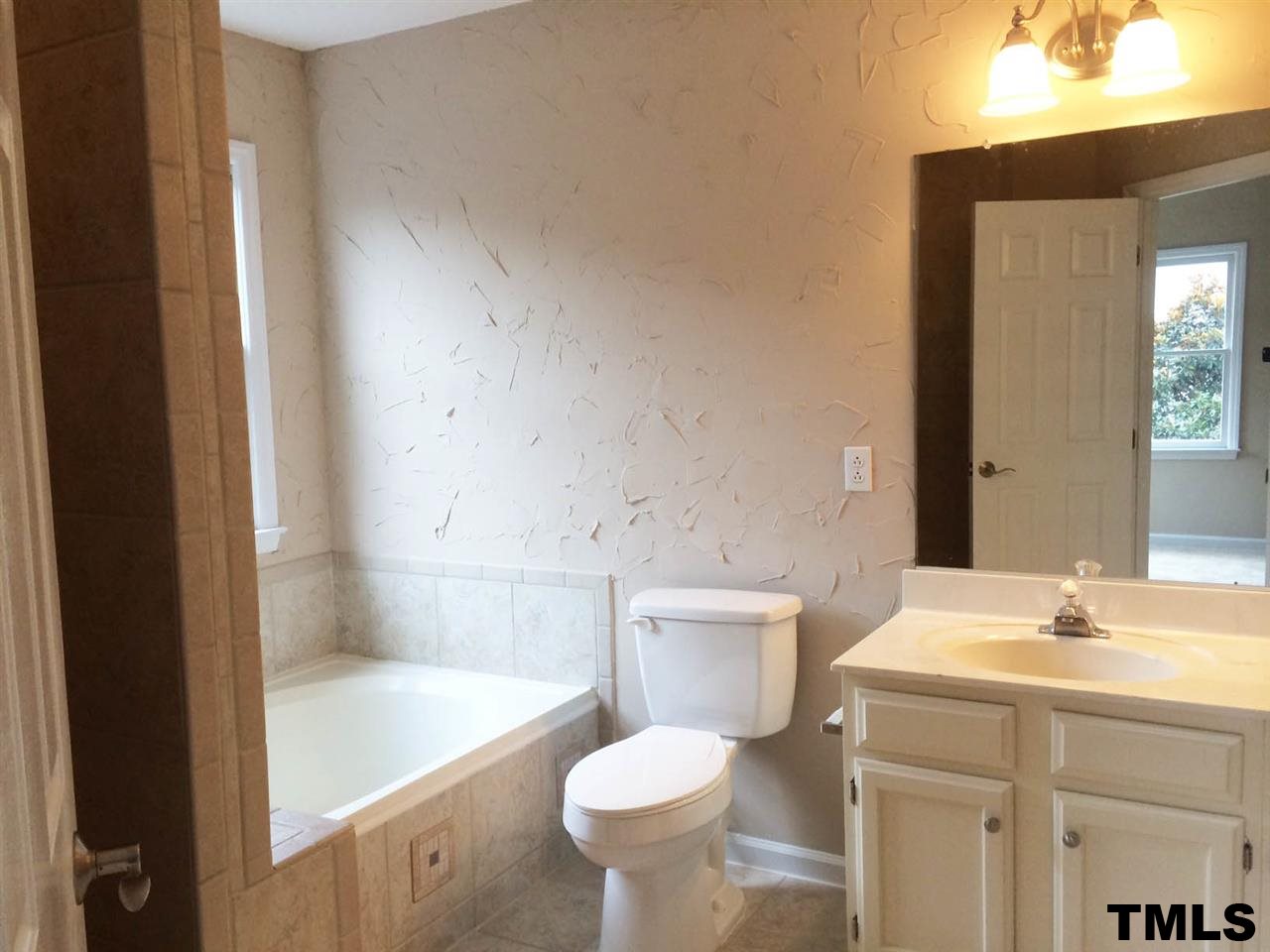 1607 Edenderry Court Garner, NC 27529 - Photo 13 of 22 a bathroom with a sink toilet and shower