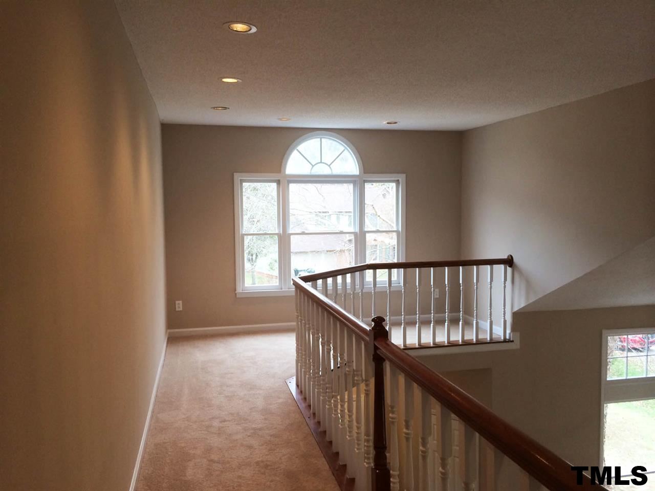 1607 Edenderry Court Garner, NC 27529 - Photo 19 of 22 a view of a hallway with windows