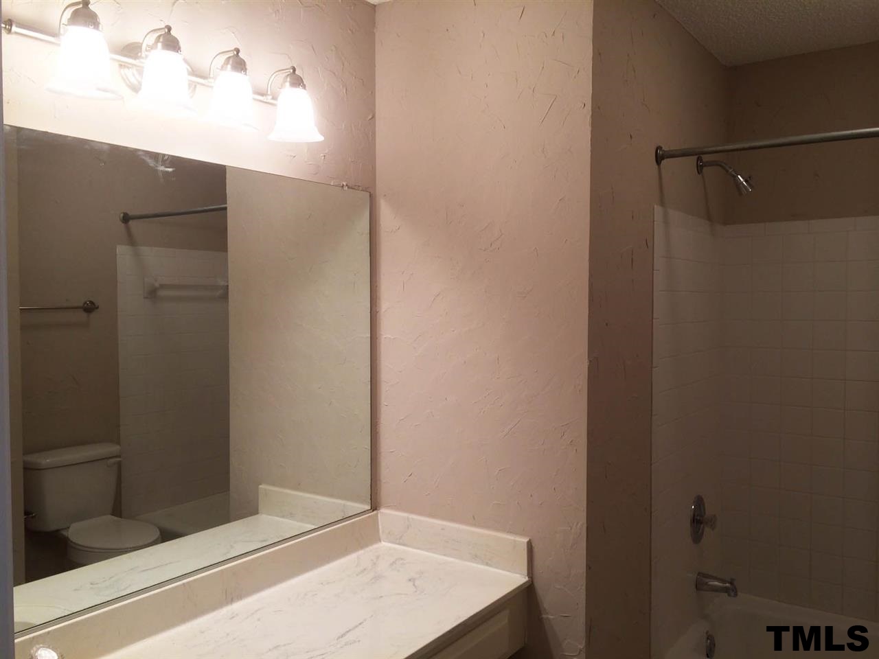 1607 Edenderry Court Garner, NC 27529 - Photo 20 of 22 a bathroom with a shower