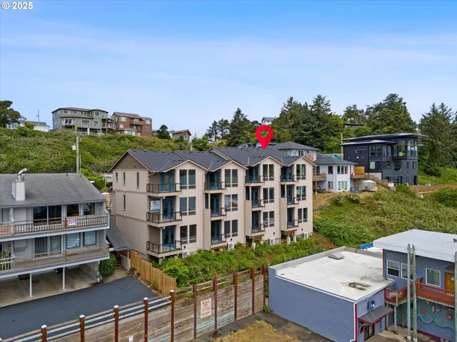 a view of a big yard in front of a brick building