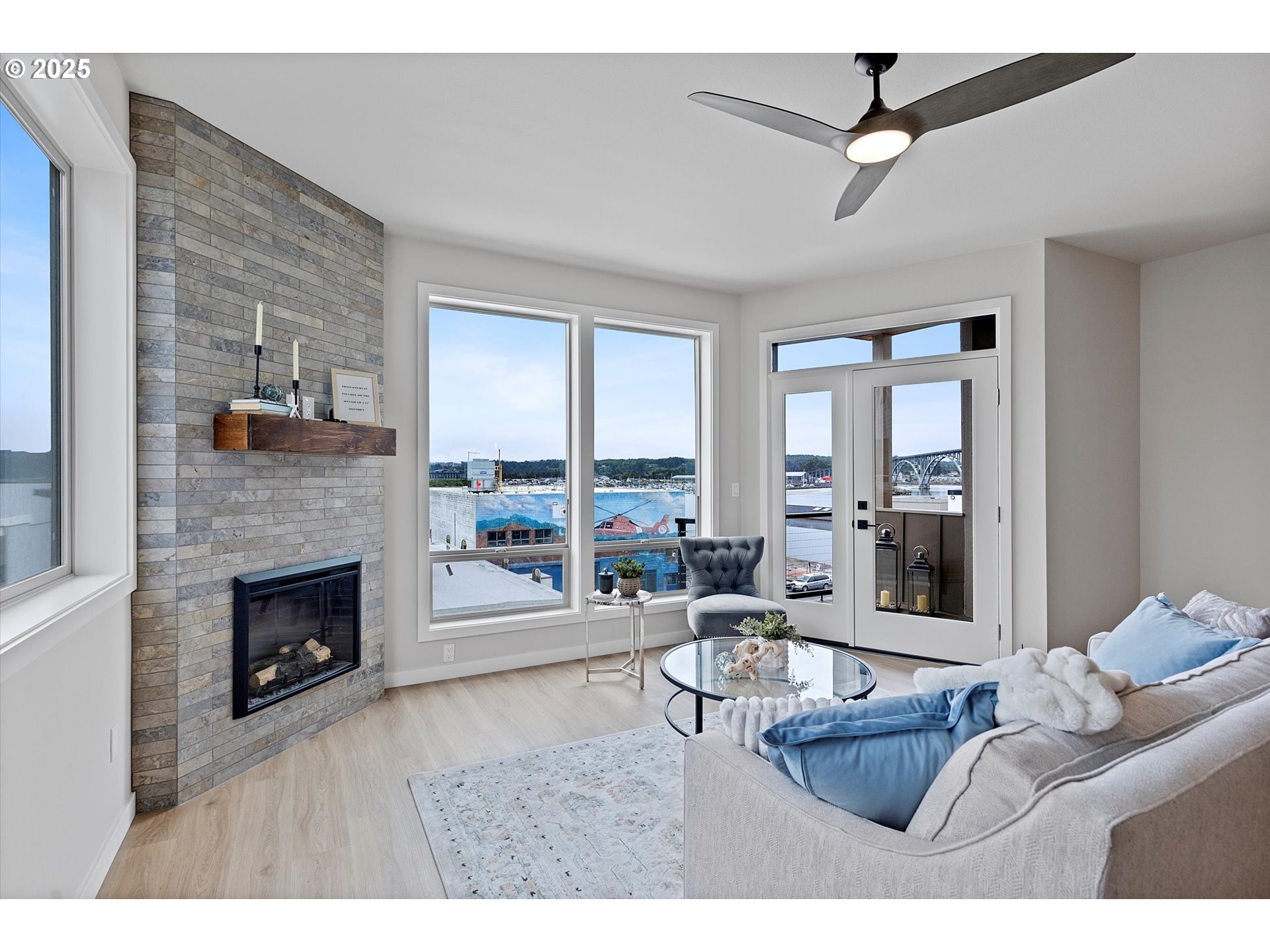 811 Southwest 13th Street Newport, OR 97365 - Photo 12 of 45 a living room with furniture and a fireplace