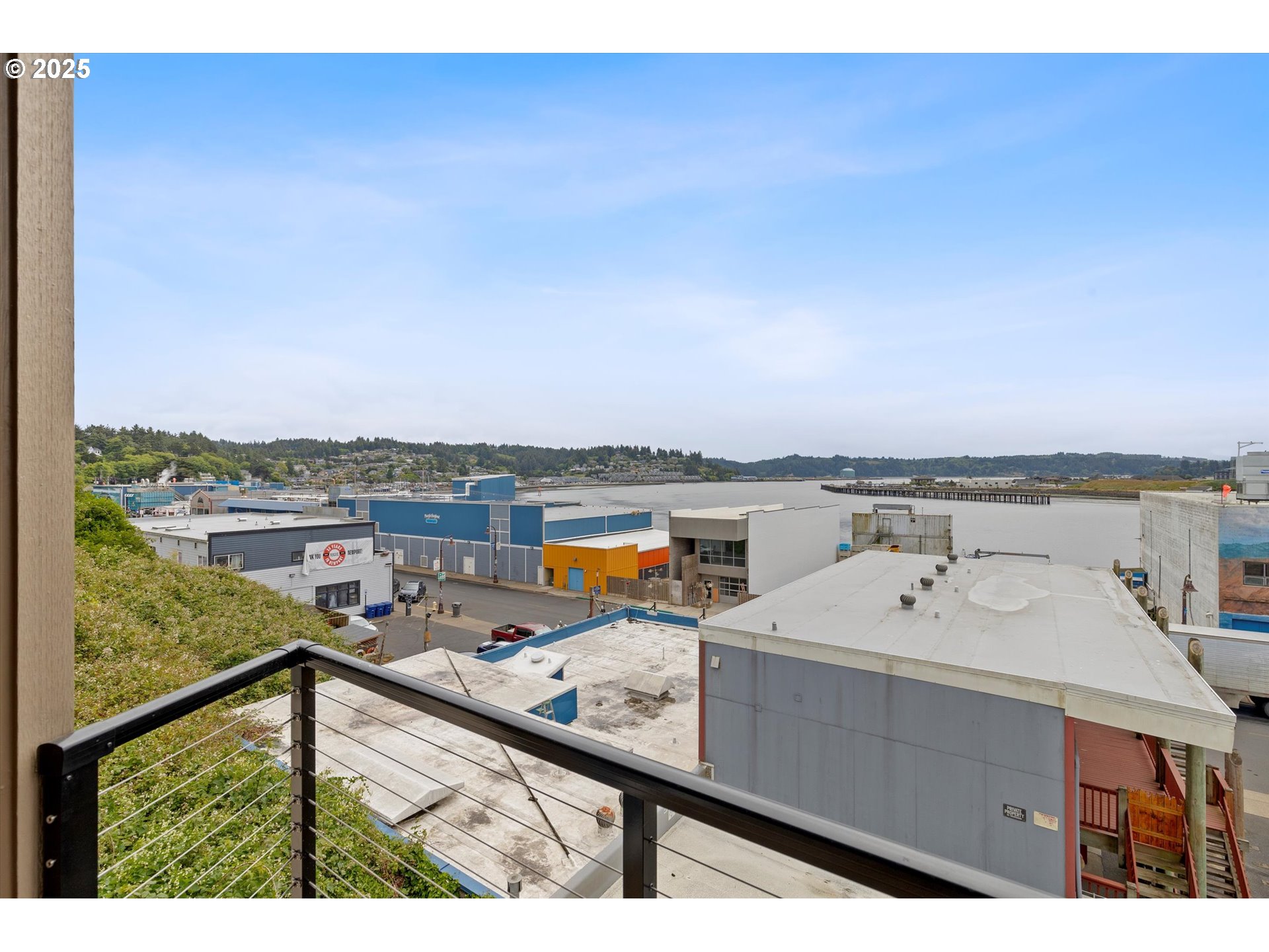 811 Southwest 13th Street Newport, OR 97365 - Photo 17 of 45 a view of a balcony with wooden floor and city view