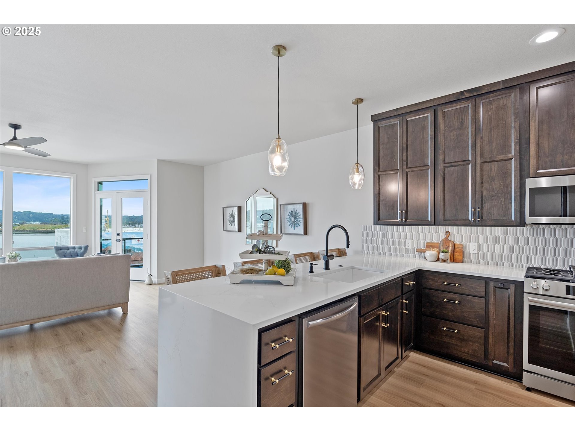 811 Southwest 13th Street Newport, OR 97365 - Photo 6 of 45 a kitchen with a sink stove and cabinets