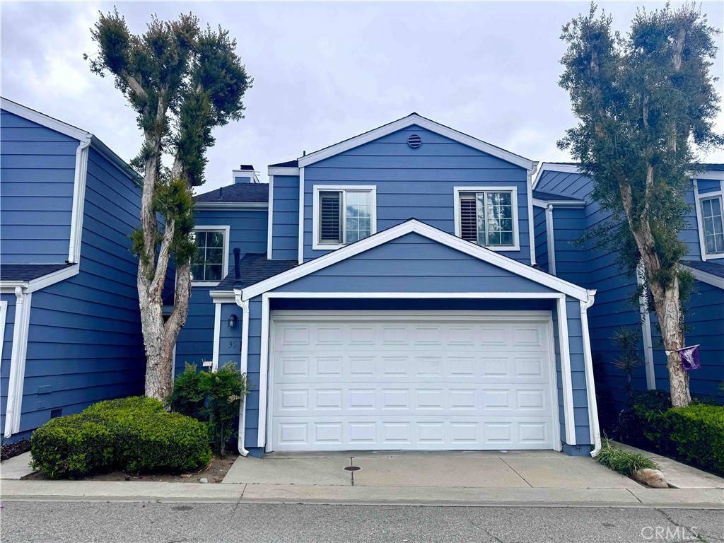 14152 Foothill Boulevard, Unit 35 Sylmar, CA 91342 - Photo 1 of 30 a front view of a house with a yard