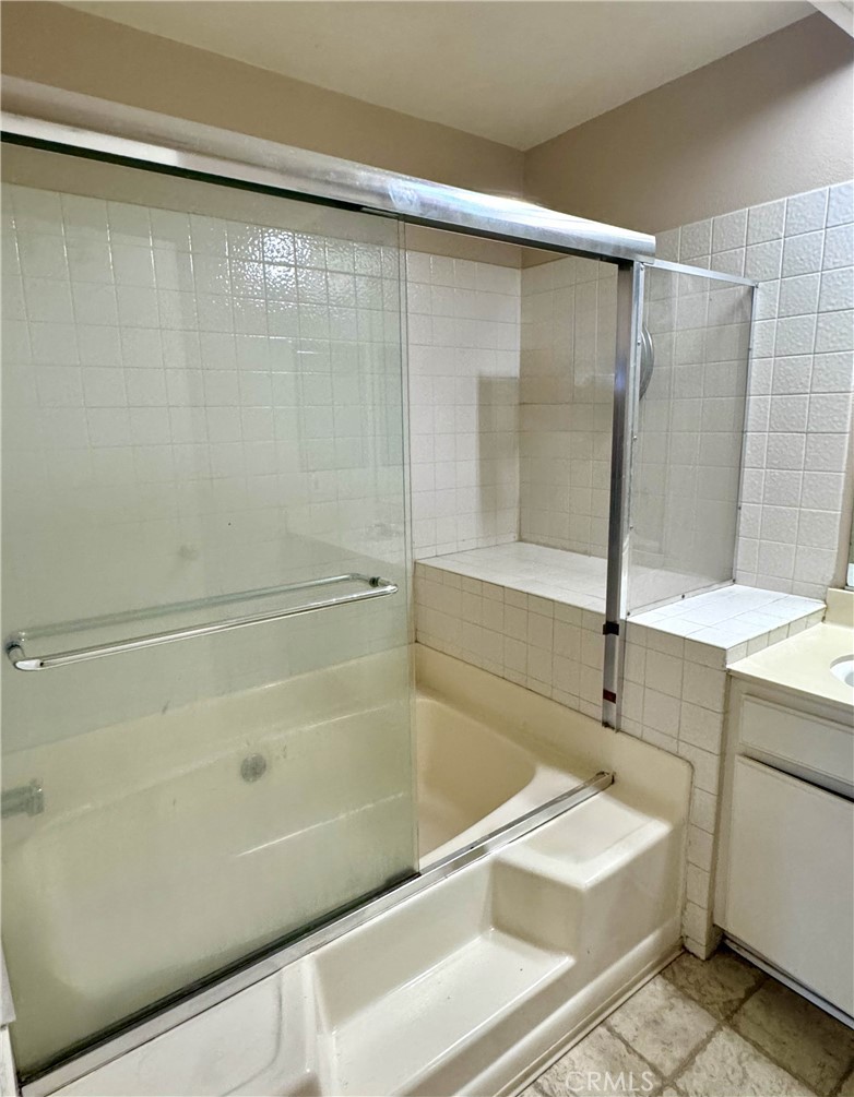 14152 Foothill Boulevard, Unit 35 Sylmar, CA 91342 - Photo 22 of 30 a bathroom with a sink and a bathtub