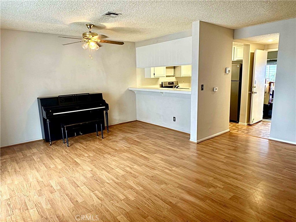 14152 Foothill Boulevard, Unit 35 Sylmar, CA 91342 - Photo 5 of 30 wooden floor in an empty room