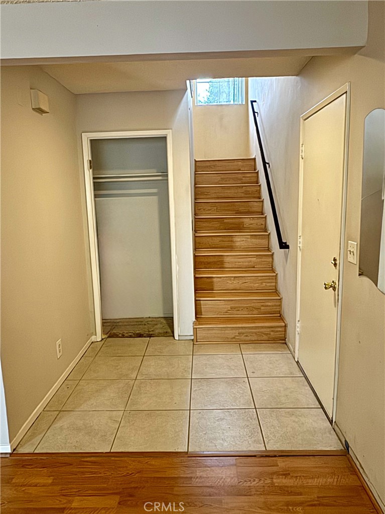 14152 Foothill Boulevard, Unit 35 Sylmar, CA 91342 - Photo 8 of 30 a view of a hallway with wooden floor and staircase