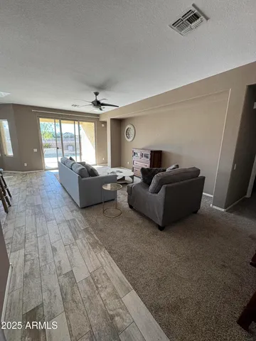 a living room with furniture and a window