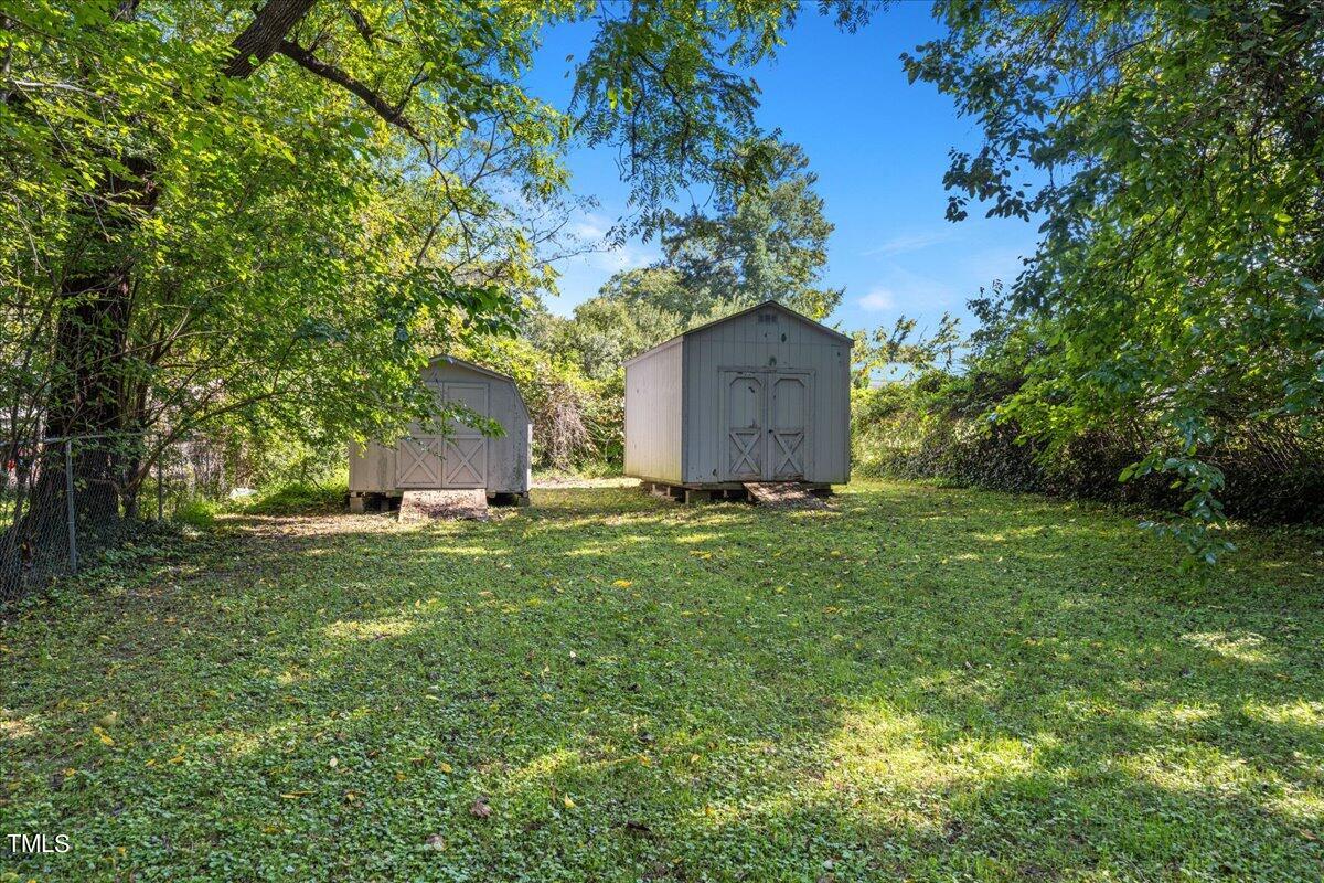 205 Spring Street Durham, NC 27703 - Photo 25 of 25 Rear backyard view w/ storage sheds