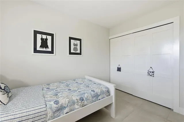 a bedroom with a bed and hallway