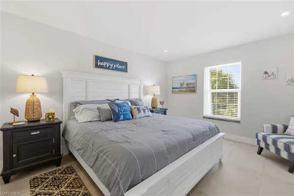 a bed room with a bed and a lamp