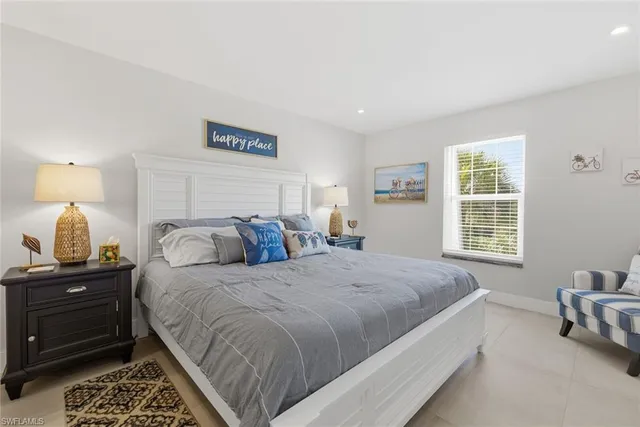 a bed room with a bed and a lamp