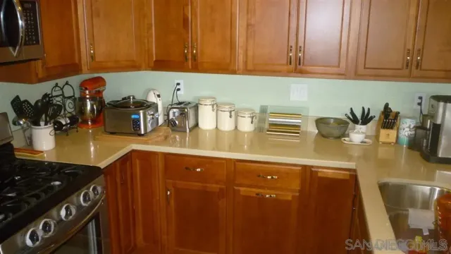 a kitchen with a sink and cabinets