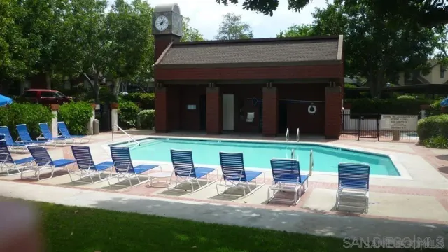 a view of a house with backyard porch and sitting area