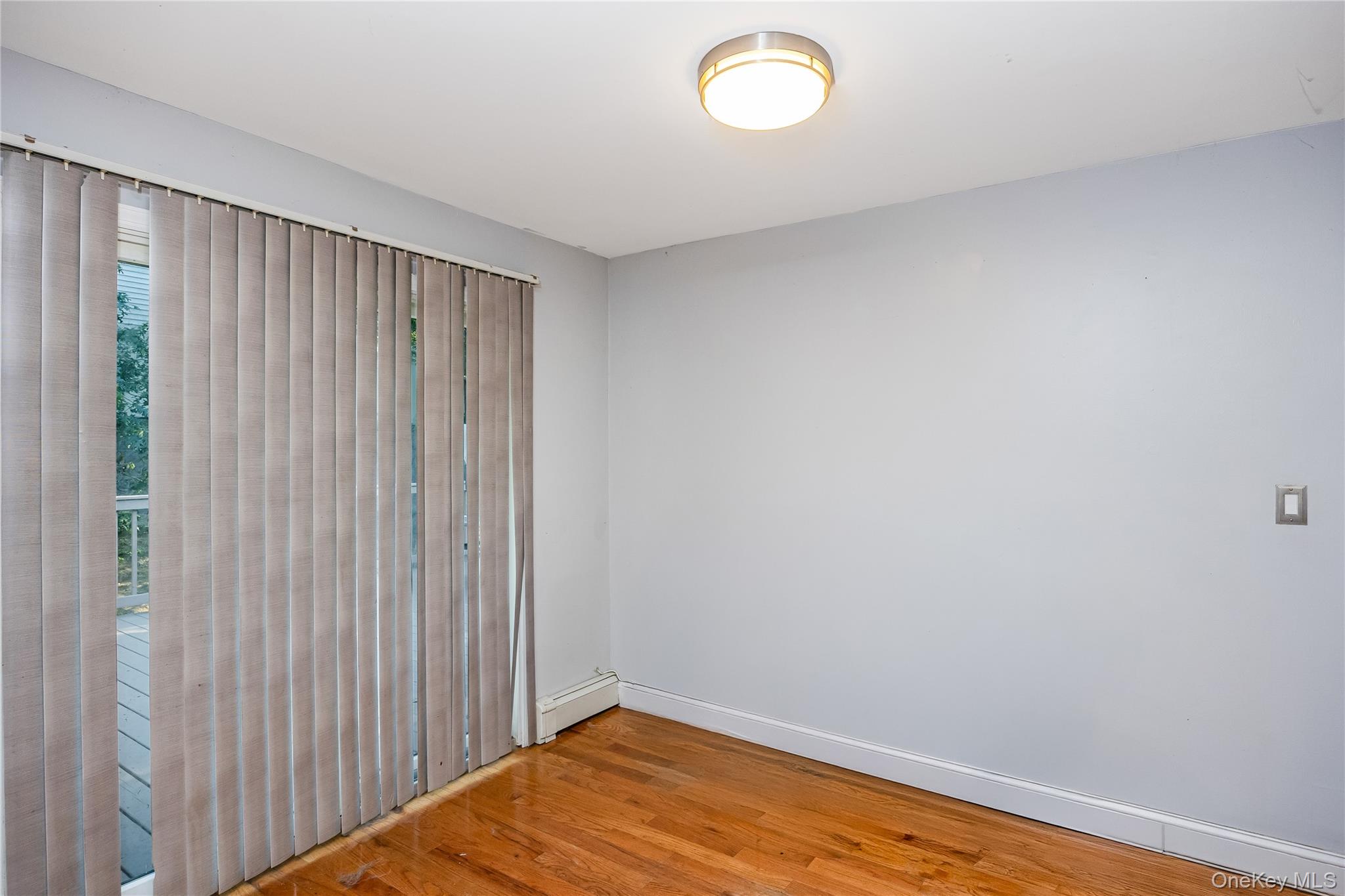 16 Hillside Road Farmingville, NY 11738 - Photo 11 of 22 a view of a room with wooden floor