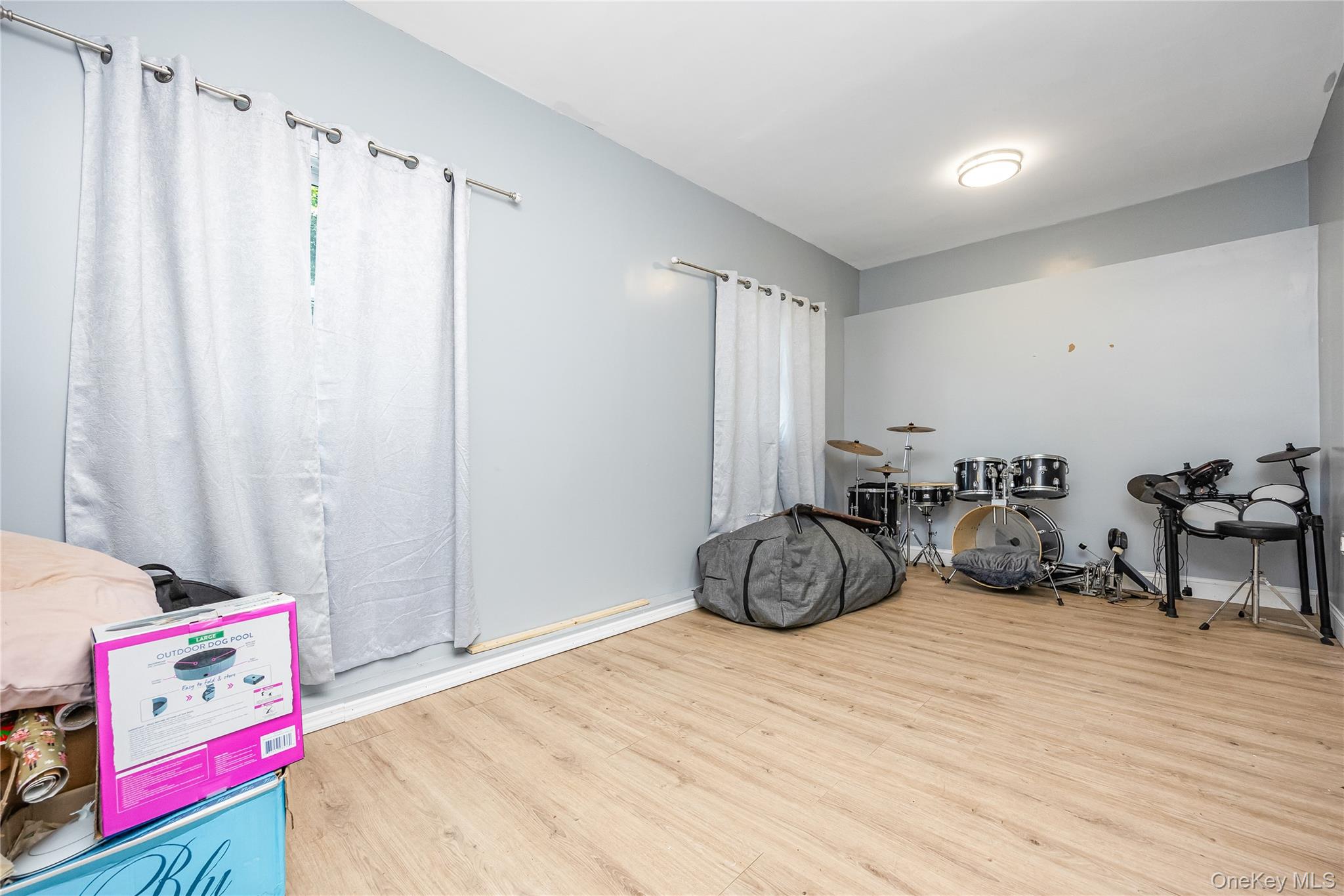 16 Hillside Road Farmingville, NY 11738 - Photo 16 of 22 a bedroom with furniture and a bed