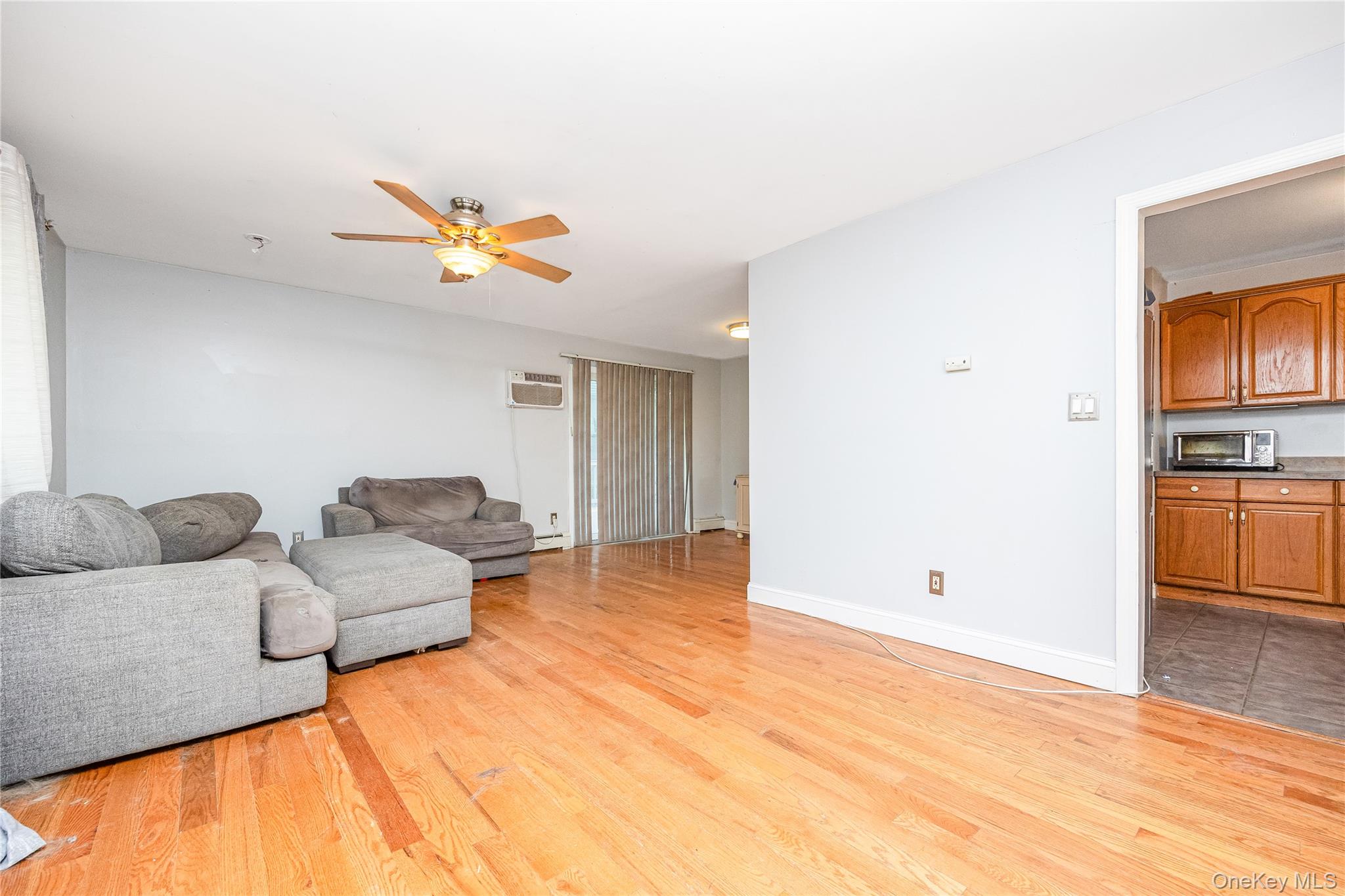 16 Hillside Road Farmingville, NY 11738 - Photo 6 of 22 a living room with furniture and kitchen view