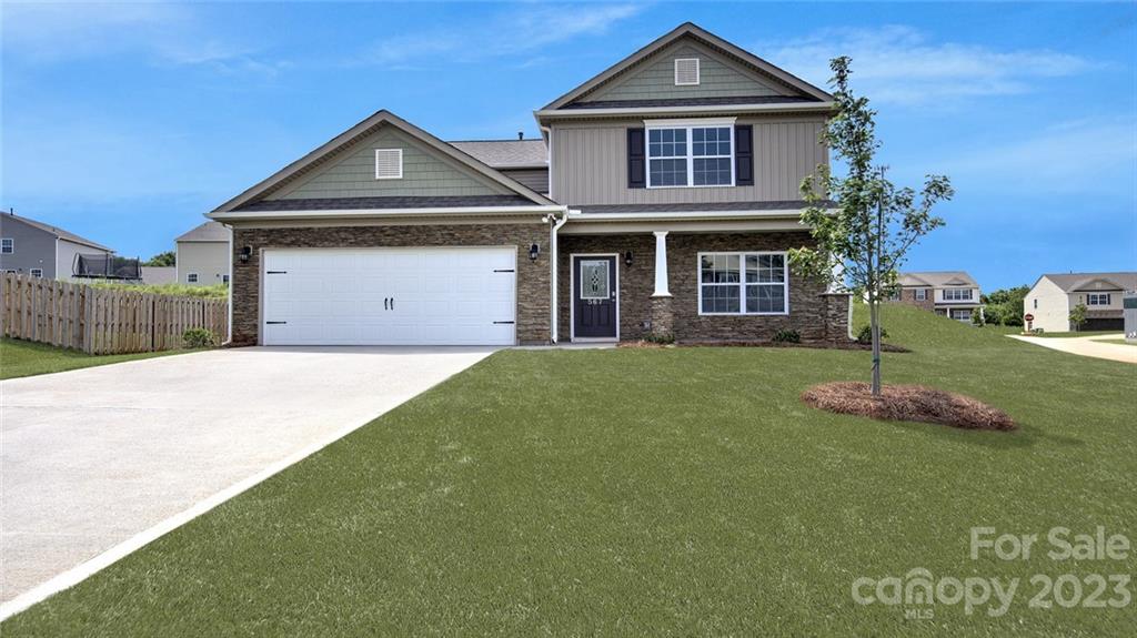 135 Ridgeview Lane Mars Hill, NC 28754 - Photo 1 of 13 a front view of a house with a garden