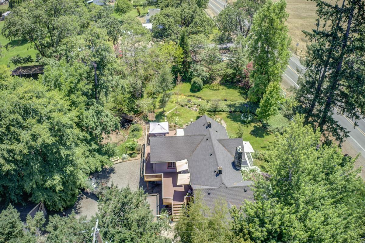 3184 Old Stage Road Central Point, OR 97502 - Photo 14 of 31 an aerial view of a house with yard and trees all around
